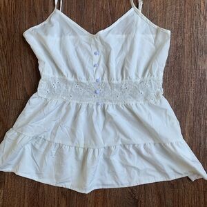 White babydoll top with lace detailing and button-up design